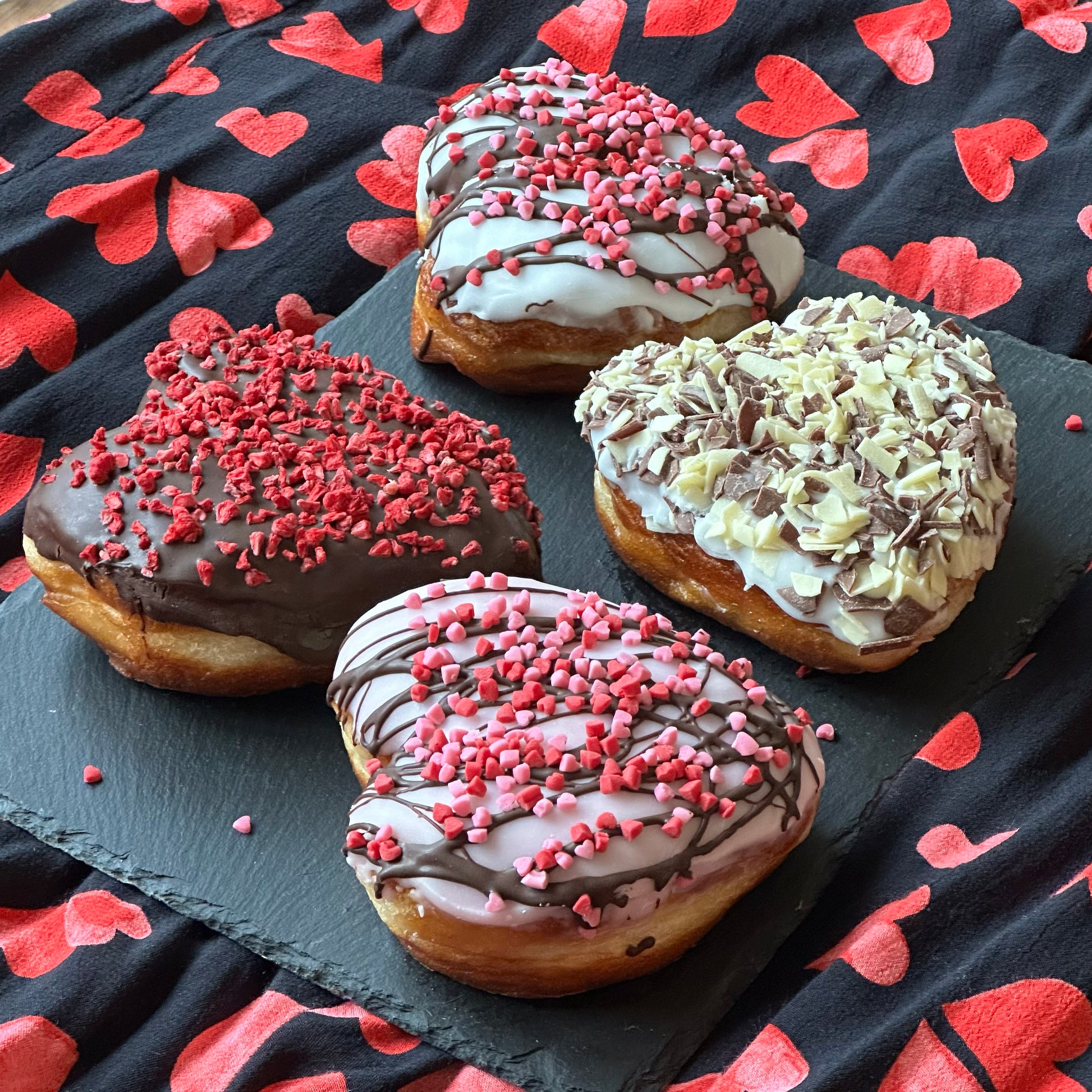 Valentine's heart-shaped doughnuts with colourful toppings