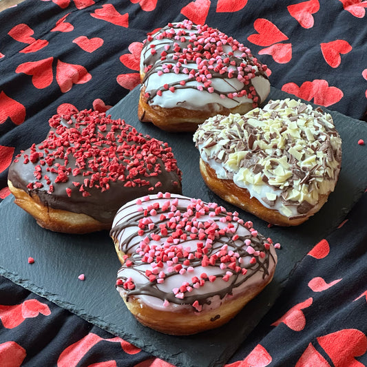 Valentine's heart-shaped doughnuts with colourful toppings